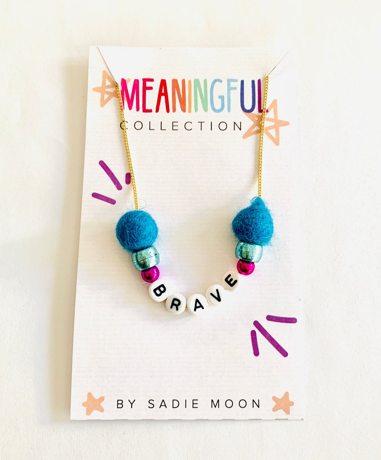 gold meaningful brave pom pom necklace