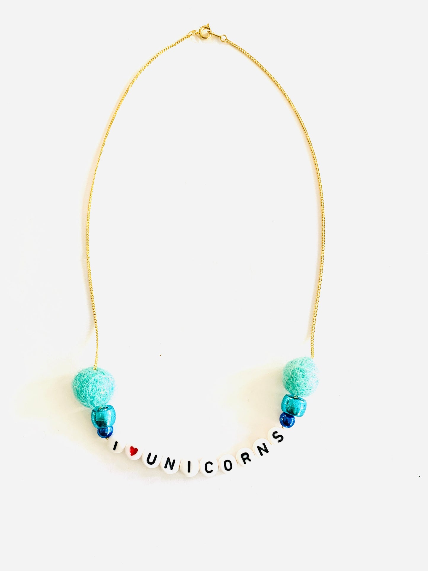 blue pom pom unicorn necklace