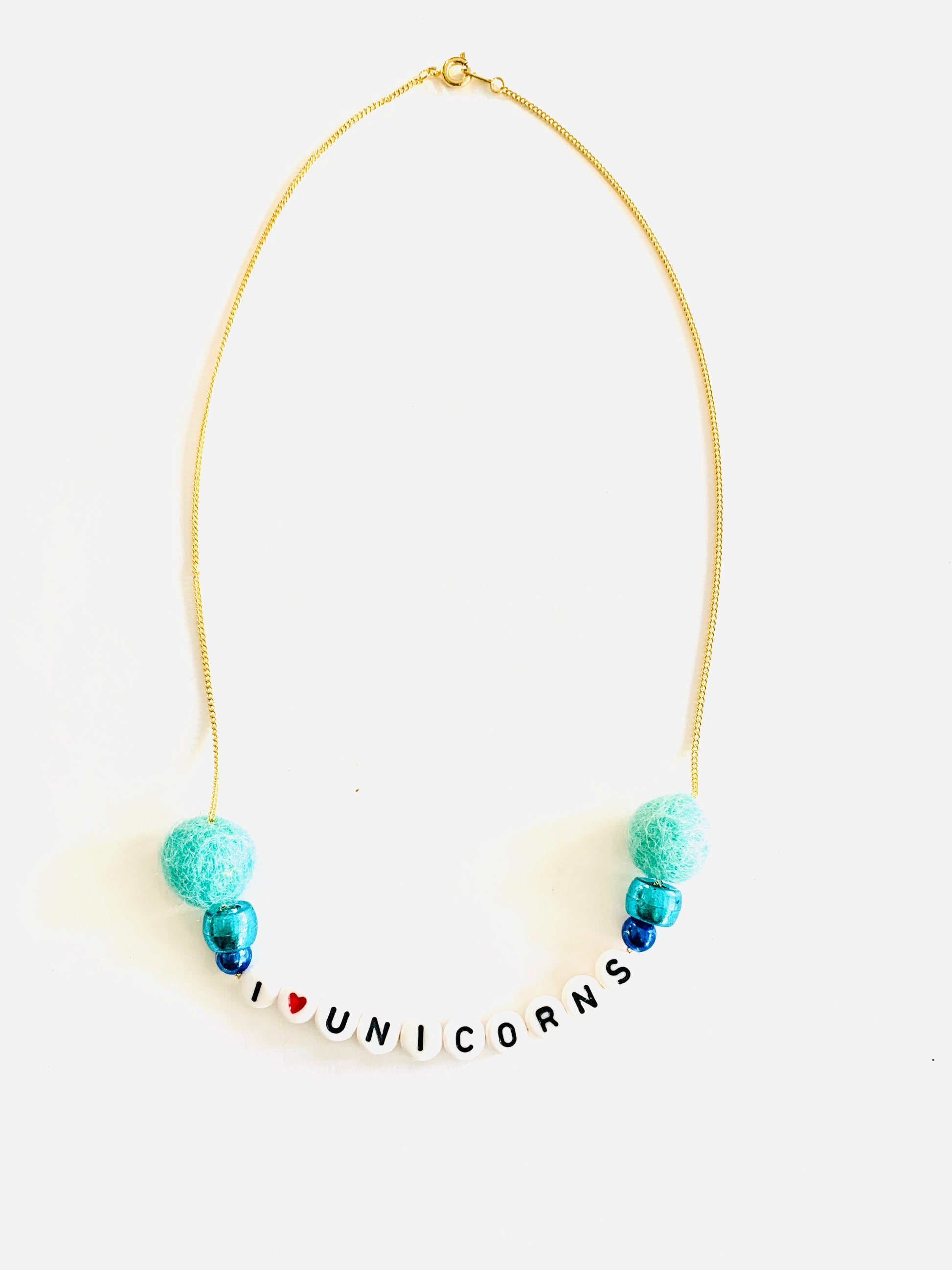blue pom pom unicorn necklace