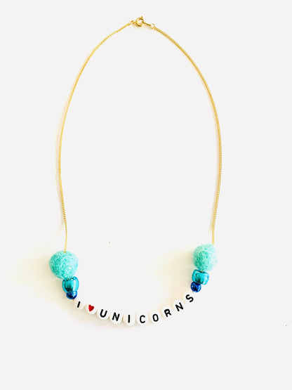 blue pom pom unicorn necklace