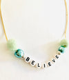 believe pom pom necklace green